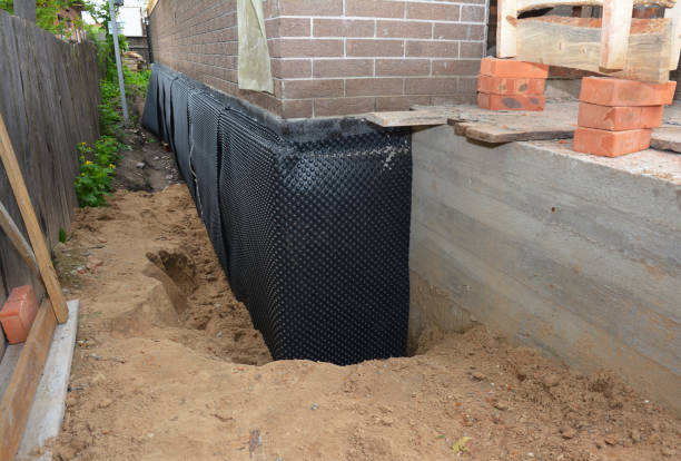 SJ Waterproofing Pros technician performing targeted Basement Waterproofing assessment in Logansport, IN